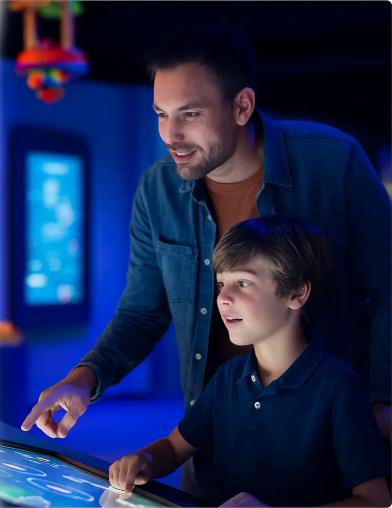 father and son at indoor experience